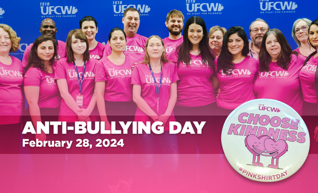 UFCW members wearing pink shirts in recognition of Anti-Bullying Day. Image of button with cartoon graph of two heart-shaped cartoons hugging. Text behind cartoons reeds "Choose Kindness" and "#PINKSHIRTDAY"